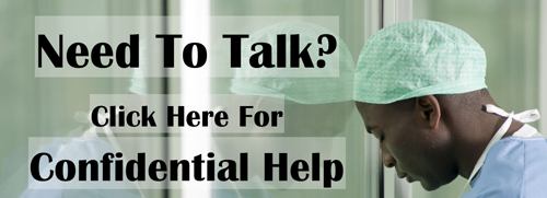 Male surgeon head down. Need to talk? Confidential help. Click here.